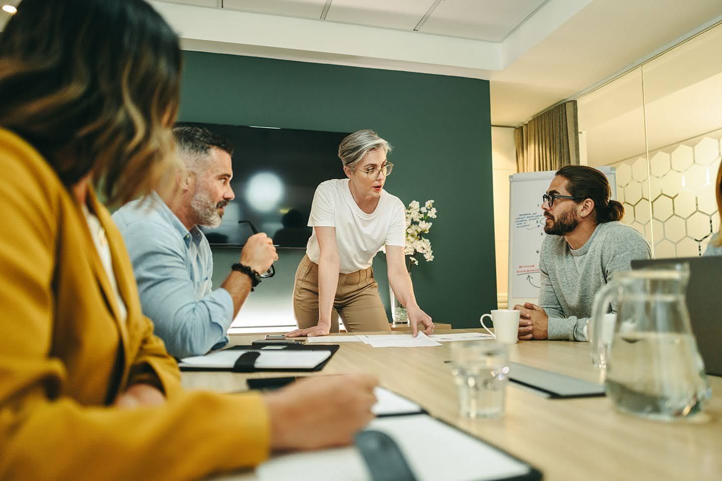A group of people discussing in a room