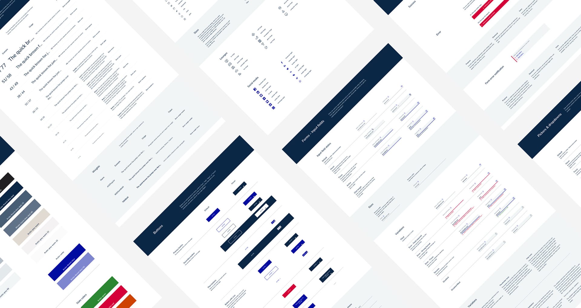 Angled view of website design documentation showing multiple page layouts, navigation elements, and colour schemes in navy and red.